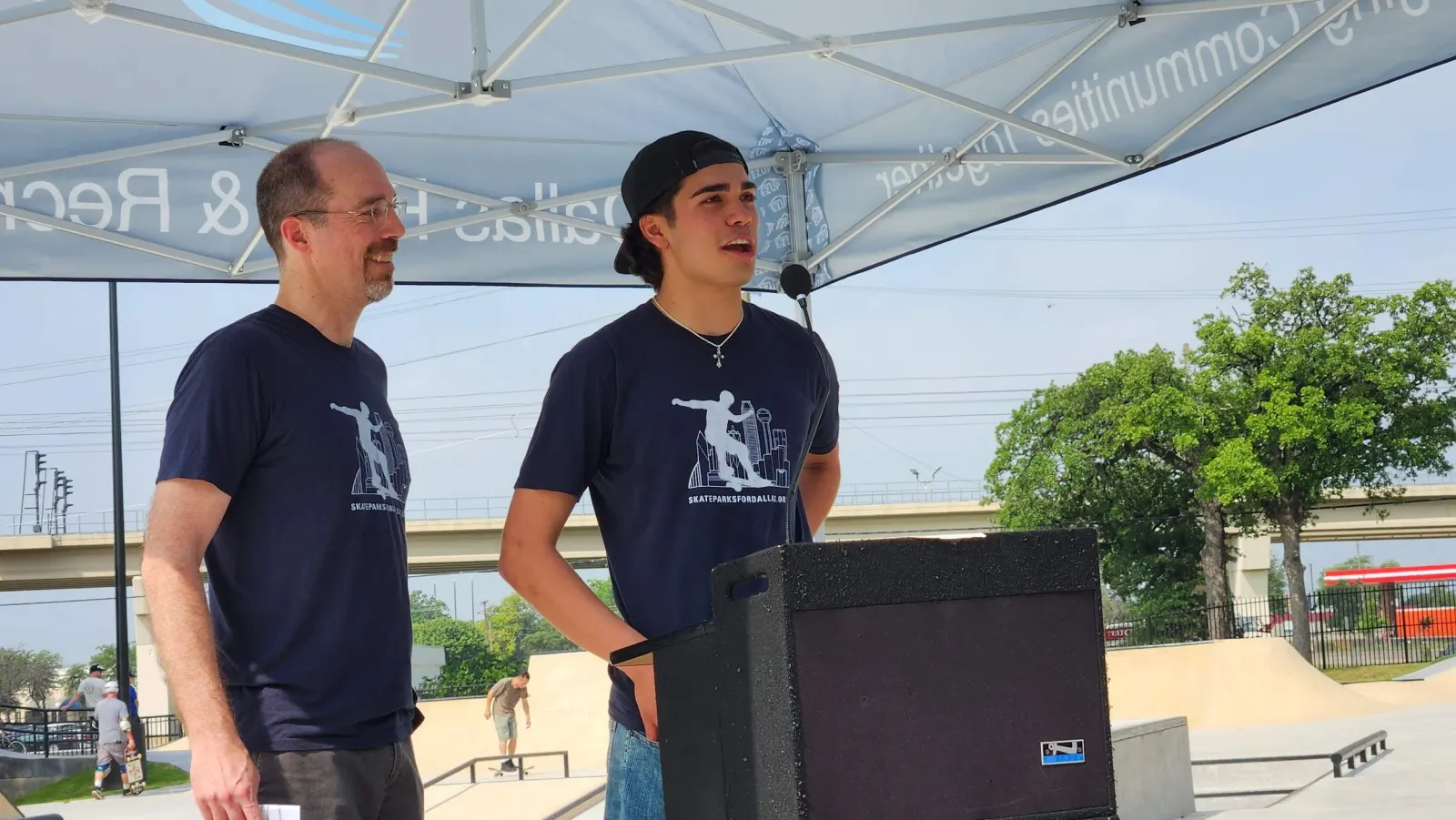 Dr. Haley and his now 17 year old son Travis celebrating the Bachman Lake Skatepark