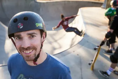 Dr. Clinton Haley, founder of Skateparks for Dallas skating with friends and his son