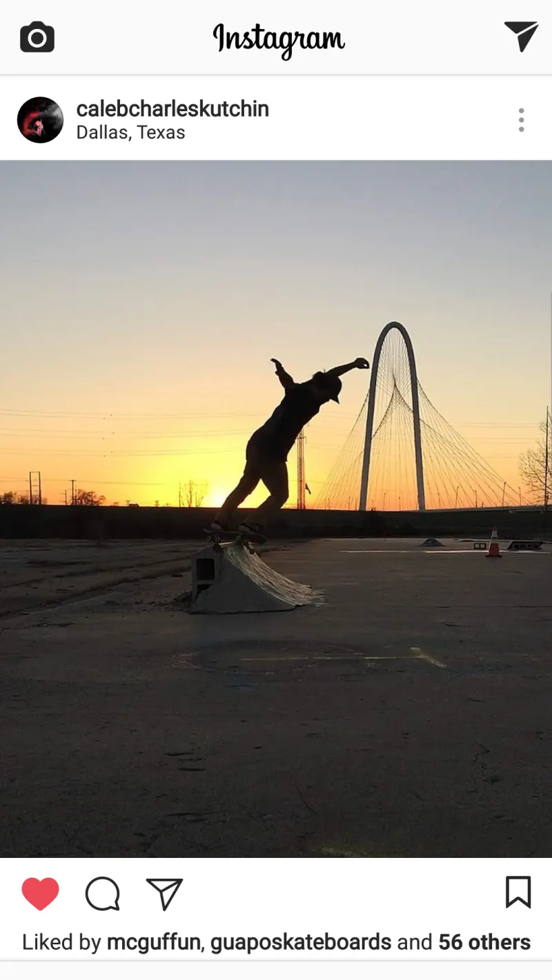 Dallas skater Caleb Kutchin skating against a silhouette of the Margaret Hunt Hill Bridge in Dallas