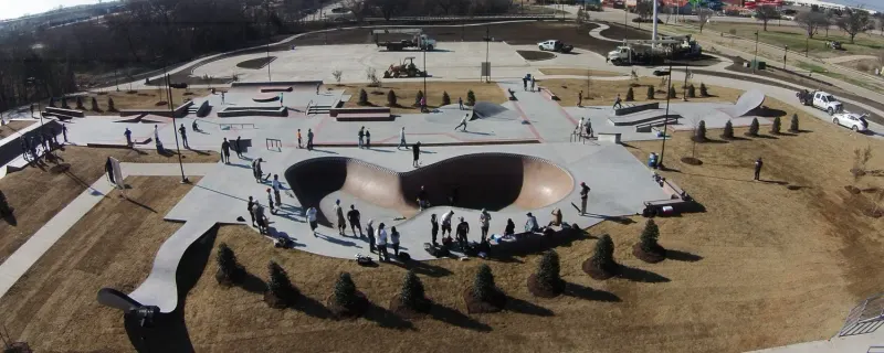 The pool feature includes 'diner-style' tiles, and the skateable spoon and metal knife rail connect to the city's motto