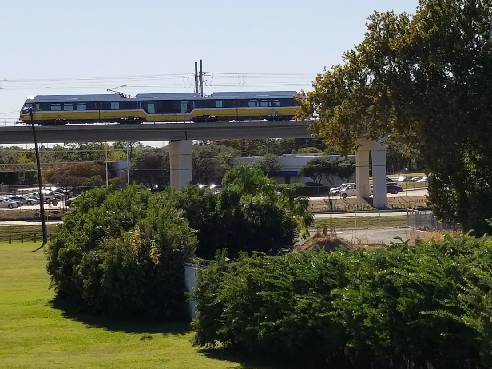 View of the DART train passing by the Bachman Lake Skatepark